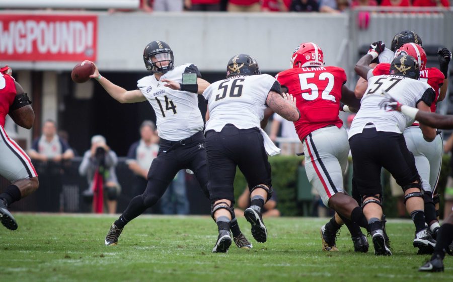 October 15th, 2016 – Kyle Shurmer passes during the Commodores 17-16 win against the University of Georgia in Sanford Stadium Saturday afternoon. Credit: Blake Dover