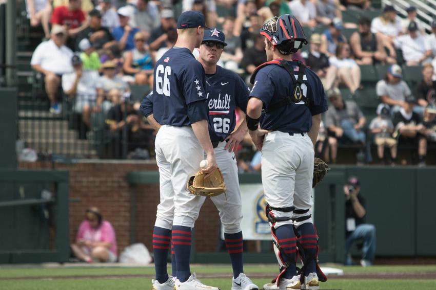 Vanderbilt starting pitcher Drake Fellows (66) meets with pitching coach Scott Brown (26) and catcher Jason Delay (right) during the Commodores 20-8 loss to Florida on April 15, 2017.