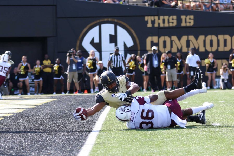 Jared Pinkney reaches across the goal line for a touchdown in Vanderbilts home victory over Alabama A&M on September 9, 2017. Photo by Claire Barnett. 