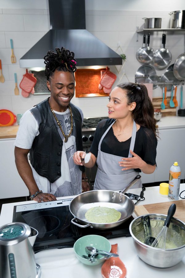 Contestant Sloane Chmara making crepes using Matcha while Host Lazarus Lynch looks on, as seen on Chopped U, Season 1. Photo courtesy the Food Network.