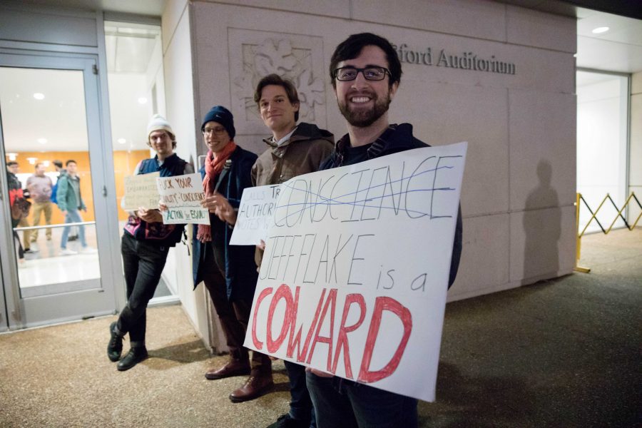 Students protest former U.S. Senator Jeff Flake at Langford Auditorium for the Chancellors Lecture Series on Thursday, January 17, 2019. (Photo by Emily Gonçalves)