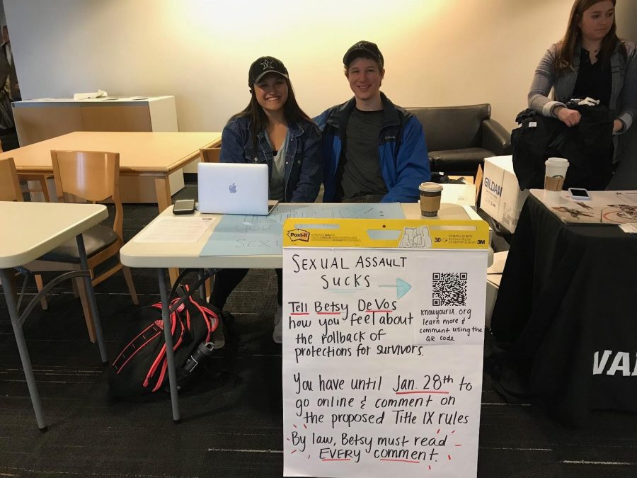 Vanderbilt students Telyse Masaoay and Henry Utset tabling in Rand on Jan. 23 to help increase student awareness of the proposed regulations and help students submit comments about the proposed changes to Title IX.  (photo by Eva Durchholz)
