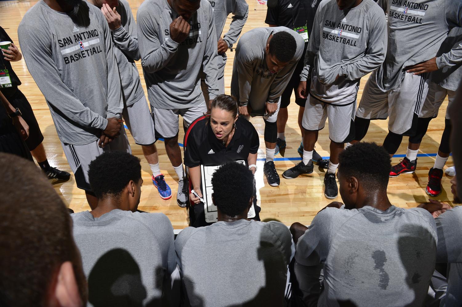 Coach Becky Hammon directs a play against the New York Knicks on July 11, 2015. Photograph by David Dow, 2015 NBAE