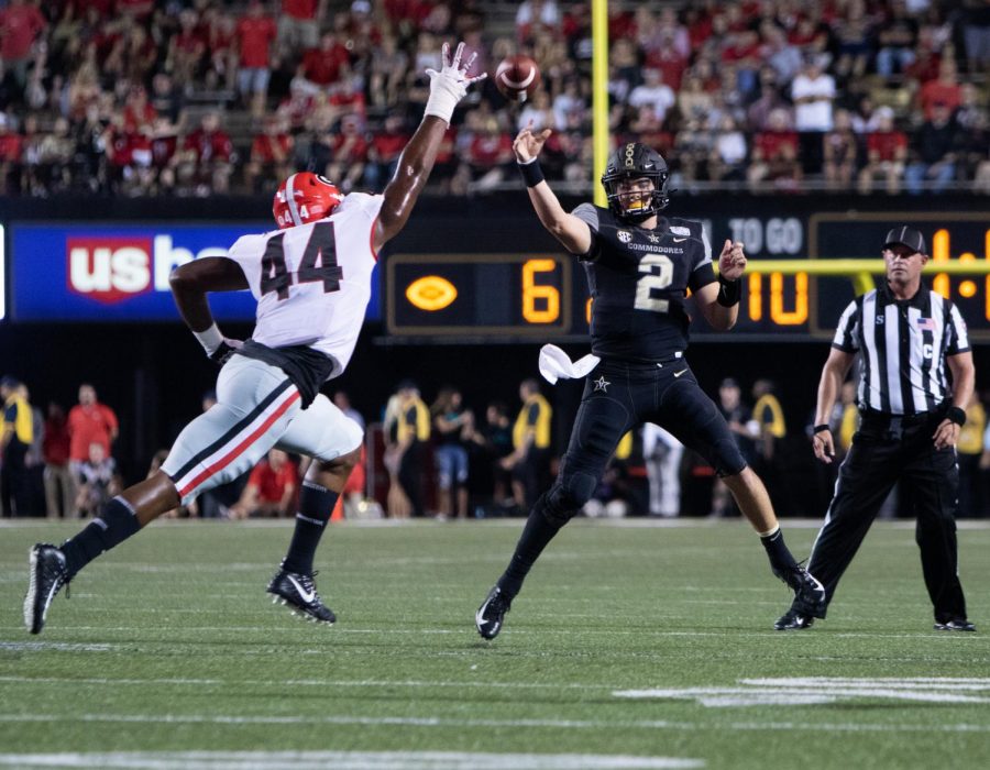 Deuce Wallace throws on the run in a 30-6 loss to Georgia on August 31, 2019. Photo by Hunter Long