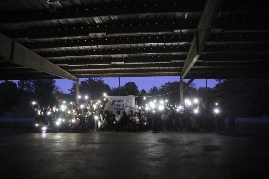 Supporters shine a light for truth at the Show Up for Cyrus event on Oct. 14