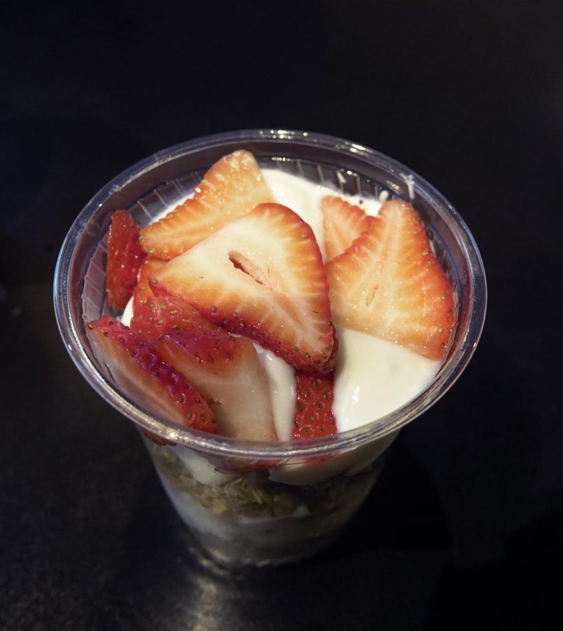 Yogurt bowl with strawberries and granola.