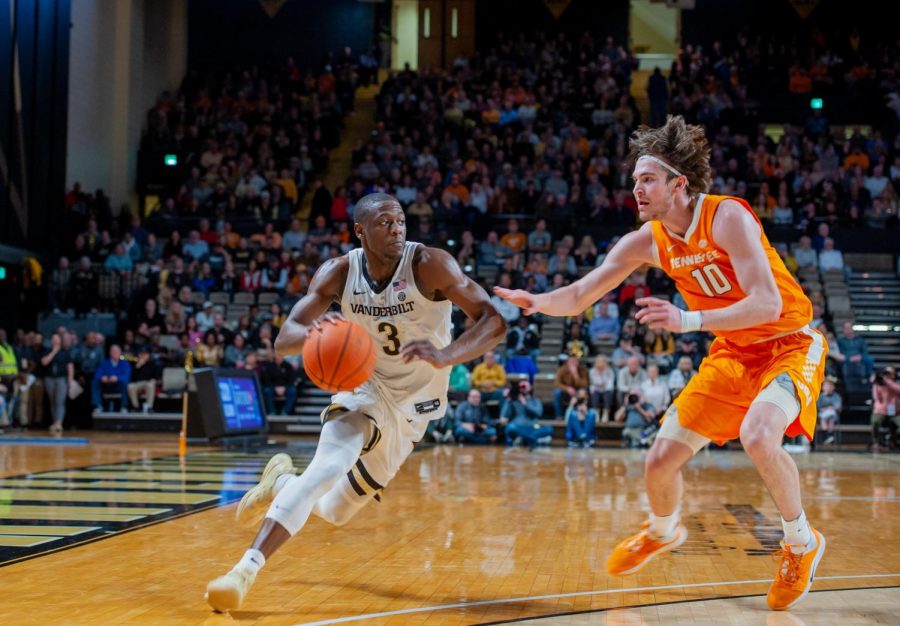 Maxwell Evans (left) drives past John Fulkerson (right) in Vanderbilts blowout loss to Tennessee.