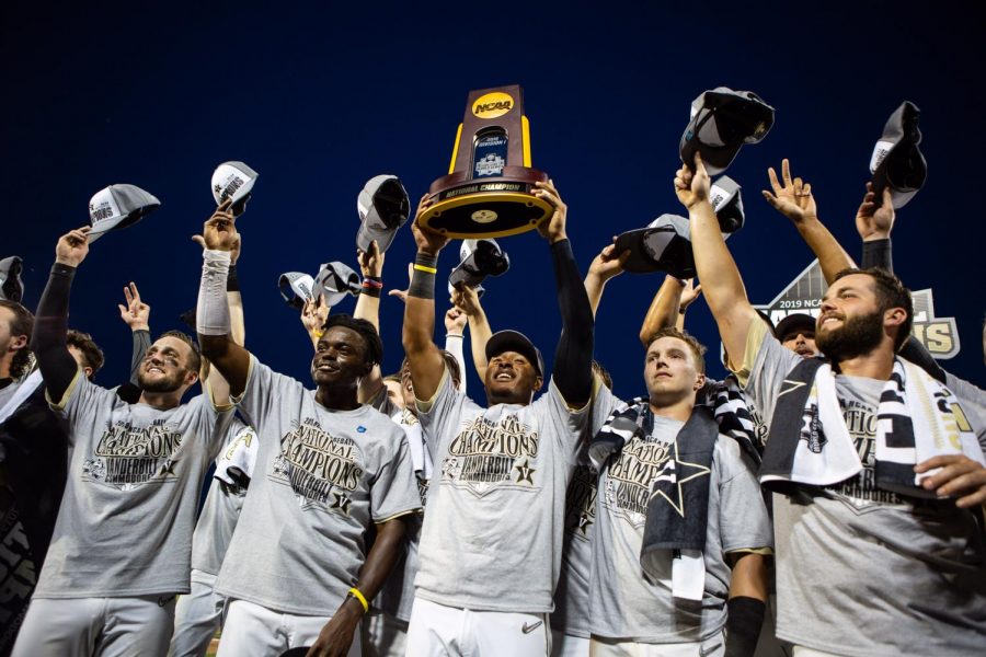 Members of the Vanderbilt Baseball Team hoist the National Championship trophy over their heads after winning the final game June 26 against the University of Michigan.