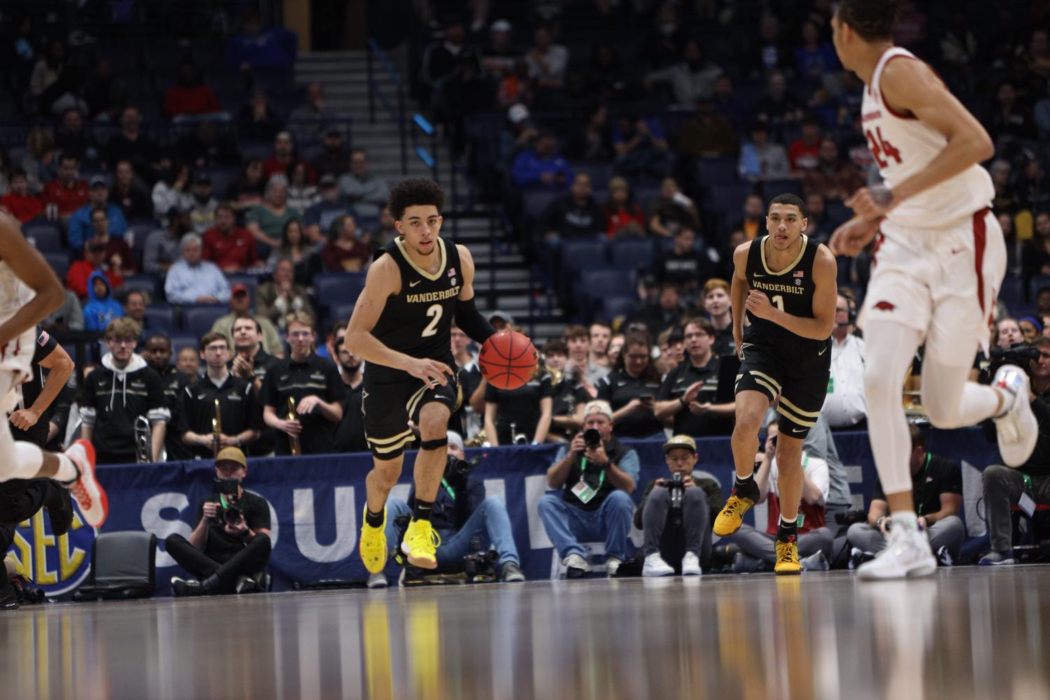 Scotty Pippen Jr. (2) pushes the ball up the court as Dylan Disu (1) trails in Vanderbilts loss to Arkansas. 