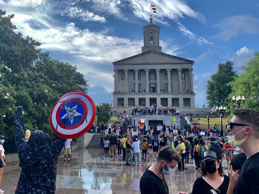 A protestor held up a Captain America shield in front of the Tennessee State Capitol.