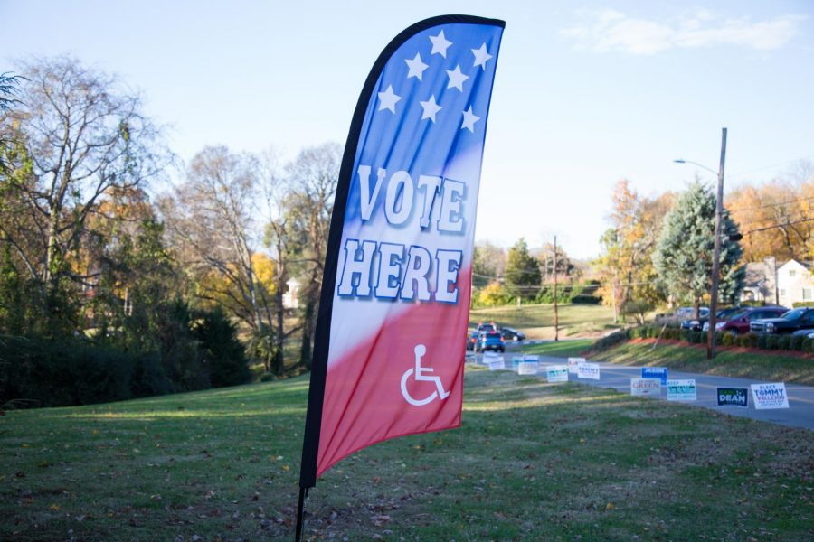A sign reads “vote here” in front of campaign yard signs for Nashville’s 2018 local candidates. (Hustler Multimedia/Claire Barnett) 