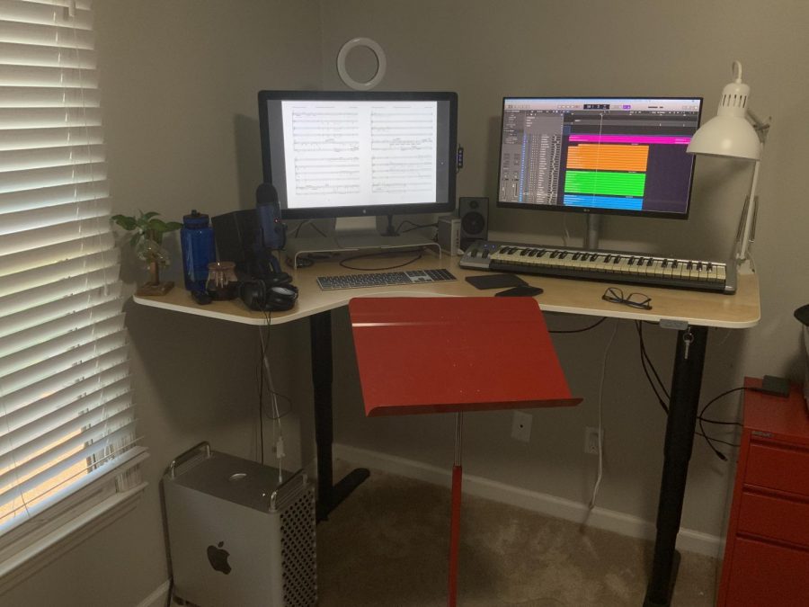Pictured is choir director Dr. Tucker Biddlecombe’s workspace setup for editing and mixing choir audio recordings (Hustler Staff/Sophie Heinz)

