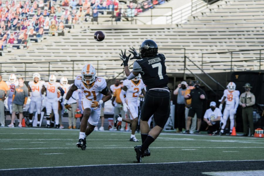 Cam Johnson reels in a catch against Tennessee on Dec. 12, 2020.