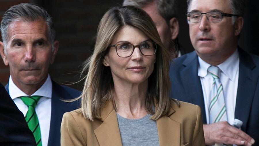 Lori Laughlin leaves courthouse April 2019 after facing charges in national college admissions scheme, Operation Varsity Blues (Shutterstock/EPA-EFE/Katherine Taylor)