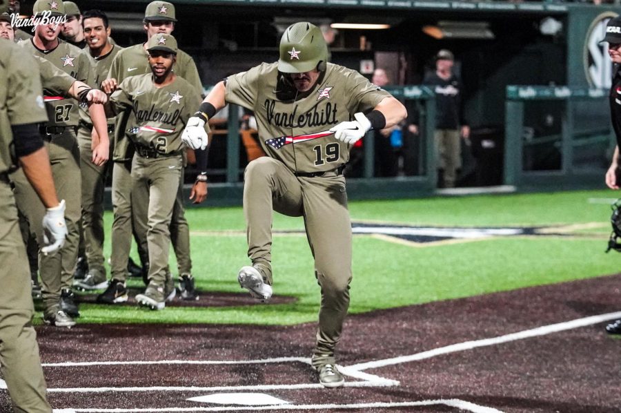 Troy LaNeve stomping on home plate after a home run against Georgia Tech (Twitter/@VandyBoys).