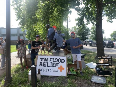 members of dores divest hosting a flood relief drive outside the red