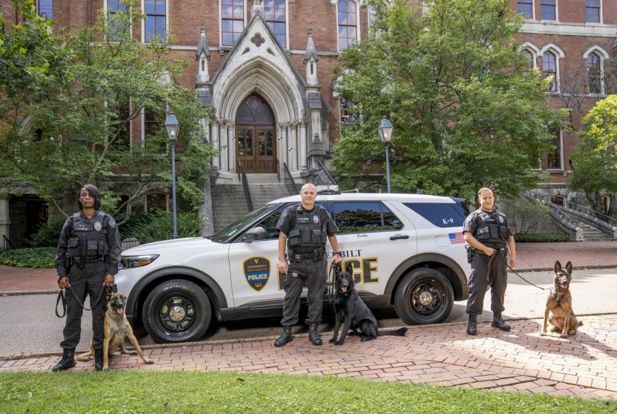 The three new K9 hires pose with their handlers outside Kirkland Hall. (Photo submitted by Officer Jason Bates)