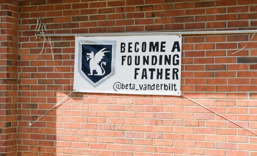 Banner hanging outside the beta house to become a founding father