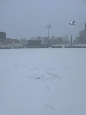 A snow angel on the pitcher's mound of Hawkins Field on Jan. 6, 2022.