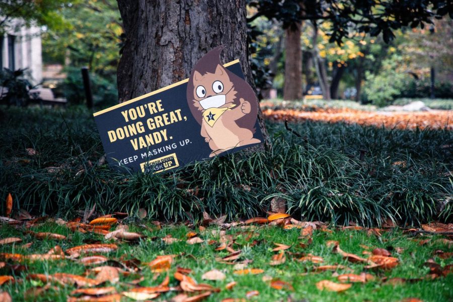 A+lawn+sign+campus+encouraging+students+to+mask+up