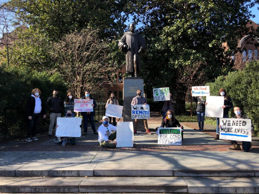 Vanderbilt graduate students and graduate workers gather at the Harold Stirling Vanderbilt statue to protest university COVID-19 policies on Jan. 18, 2021. (Hustler Staff/Sam Stubbs)