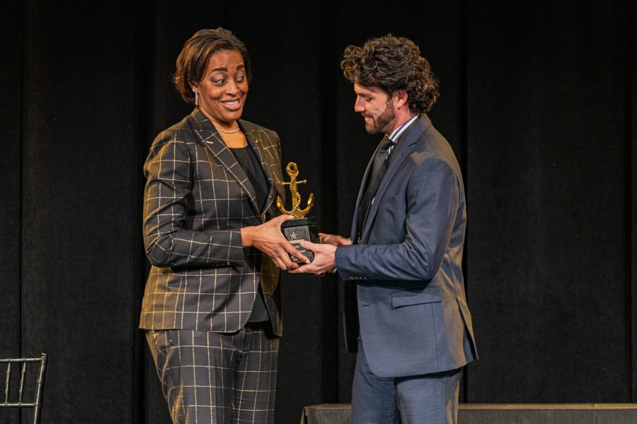 Dansby Swanson receives a trophy from Candice Storey Lee at the Vanderbilt Athletics Hall of Fame Induction Ceremony on January 28, 2022. (Hustler Multimedia/Josh Rehders)