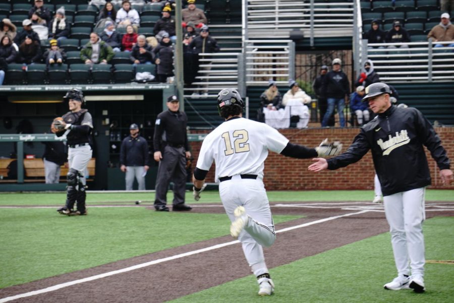 Dominic Keegan rounds the bases after hitting a home run during Game 2 against Army on Feb. 26.