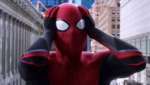Spider-Man with his hands on either side of his head