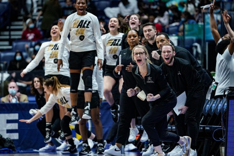 Vanderbilt bench celebrating a made shot during the first half of their SEC Tournament game against Texas A&M on March 2, 2022.