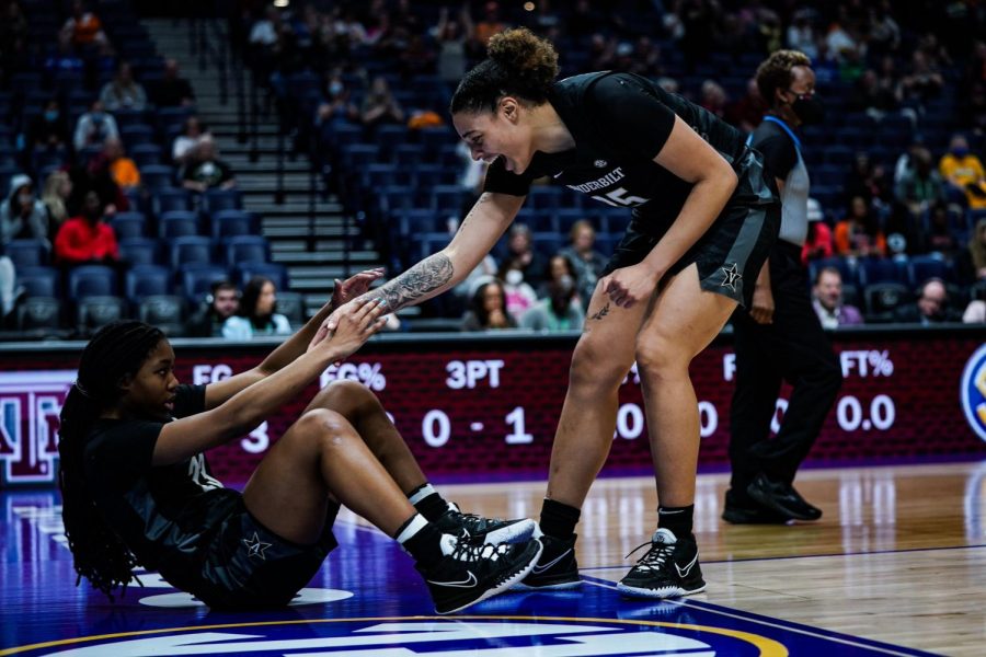 Vanderbilts pair of All-SEC freshmen Iyana Moore and Sacha Washington pick each other up during Vanderbilts SEC Tournament win over Texas A&M on March 2, 2022.