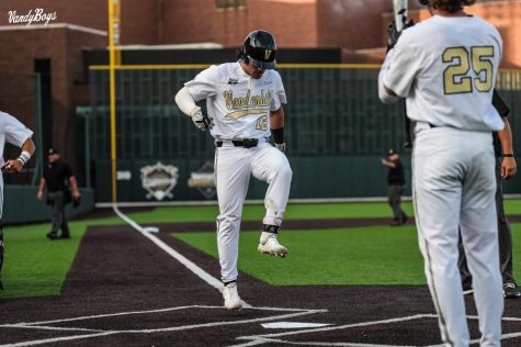 Dominic Keegan stomps on home plate after hitting a home run in Vanderbilts win over Texas A&M on April 29, 2022.
