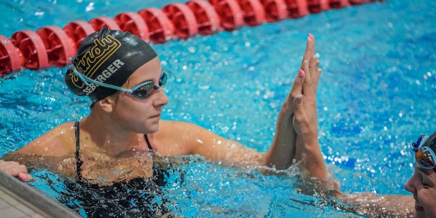Senior Gabriela Seberger gives a high-five during Vanderbilt swimmings meet against Tennessee on January 20, 2022.