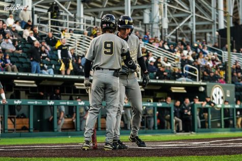 Carter Young and Calvin Hewett celebrate a four-run first inning against Tennessee Tech on April 19, 2022. (Vanderbilt Athletics)