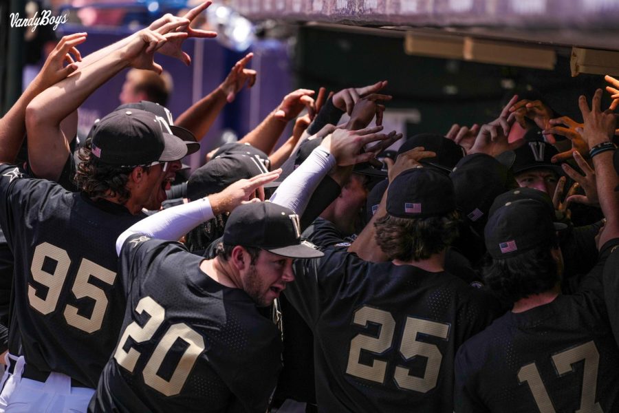 The VandyBoys huddling in the dugout at Hawkins Field
