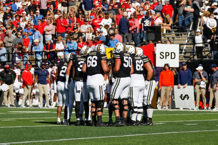 The Vanderbilt offensive line huddles, as photographed on Oct. 8, 2022. (Hustler Multimedia/Barrie Barto)