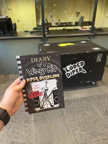 A copy of “Diary of a Wimpy Kid: Diper Överlöde” came with each ticket, as photographed on Oct. 28, 2022. (Hustler Staff/Marissa Tessier)