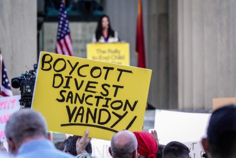 Protesters hold signs calling for sanctions against Vanderbilt, as photographed on Oct. 21, 2022. (Hustler Multimedia/Miguel Beristain).
