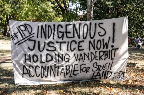 Banner hung by the Indigenous Scholars Organization on Oct. 10, 2022, on Indigenous Peoples Day.
