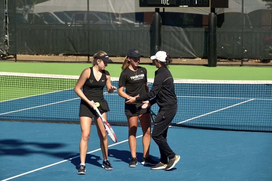 Bridget Stammel and Sonya Macavei converse briefly with their coach during set break, as photographed on Oct. 9, 2022. (Hustler Multimedia/Ophelia Lu)