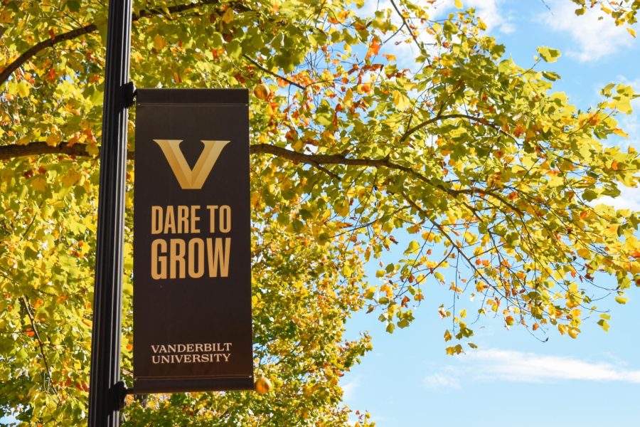 Dare+to+Grow+sign+surrounded+by+fall+leaves%2C+captured+on+Oct.+24%2C+2022.+%28Hustler+Multimedia%2FClaire+Gatlin%29