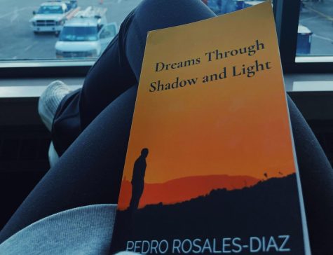 The cover of “Dreams Through Shadows and Light,” as photographed on Nov. 18, 2022. (Hustler Staff/Ella Wupperman)
