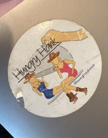 A “Hungry Hank” sticker on Ella DuCharme’s laptop, as photographed on Jan. 20, 2023. (Hustler Staff/Blythe Bouza)