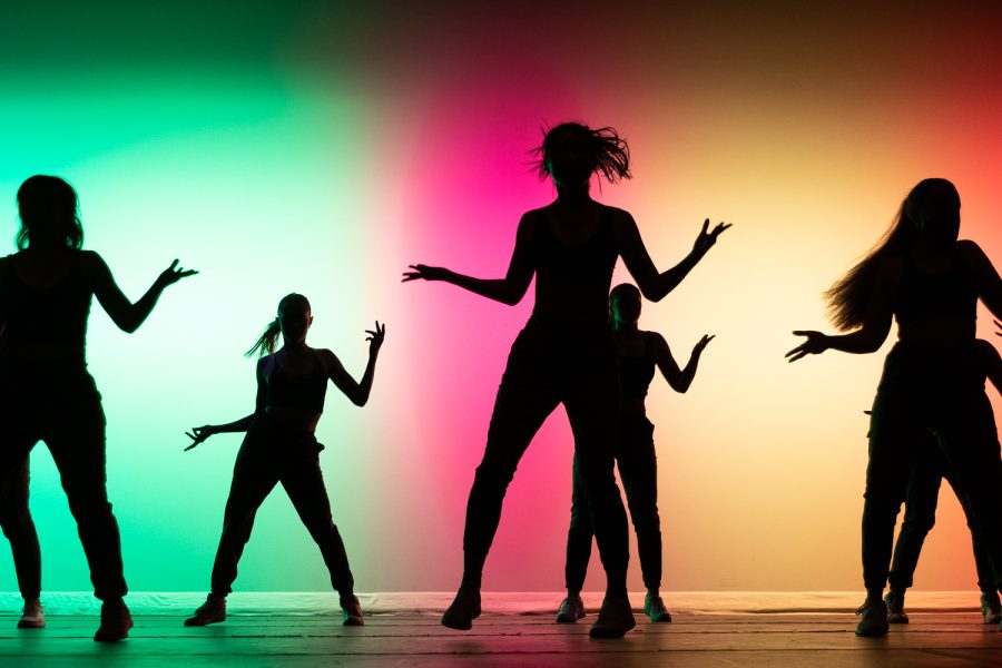 Silhouettes of dancers on stage at the VIBE show, as photographed on Feb. 11, 2023. (Hustler Multimedia/Barrie Barto)