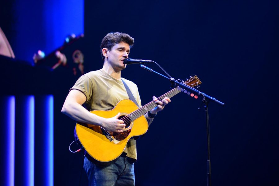 John Mayer plays his acoustic guitar at Bridgestone Arena, as photographed on March 24, 2023. (Hustler Multimedia/Connie Chen)