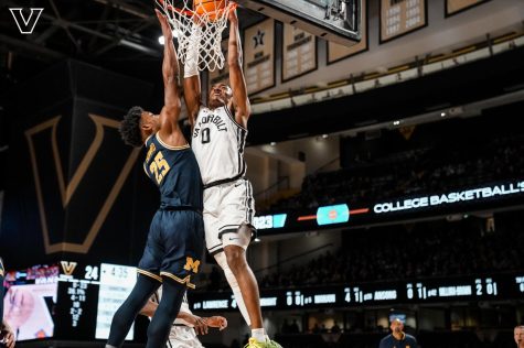 Tyrin Lawrence dunks on Michigans Jace Howard in the NIT on March 18, 2023 (Vanderbilt Athletics).