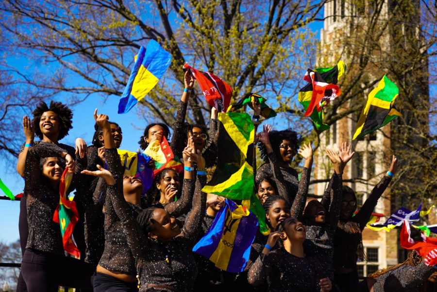 Reggae-Soca Fusion performers throw their flags up in the air, as photographed on April 1, 2023. (Hustler Multimedia/Narenkumar Thirmiya)