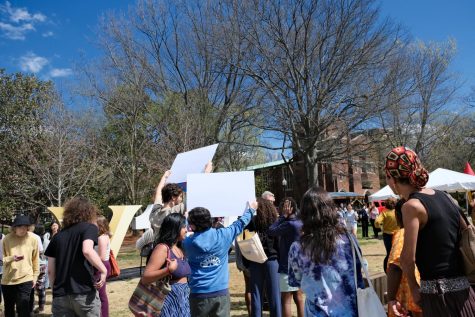 DWSN members protest in front of Chancellor Daniel Diermeier at the Community Party, as photographed on March 25, 2023. (Photo courtesy of Drew Ellis)