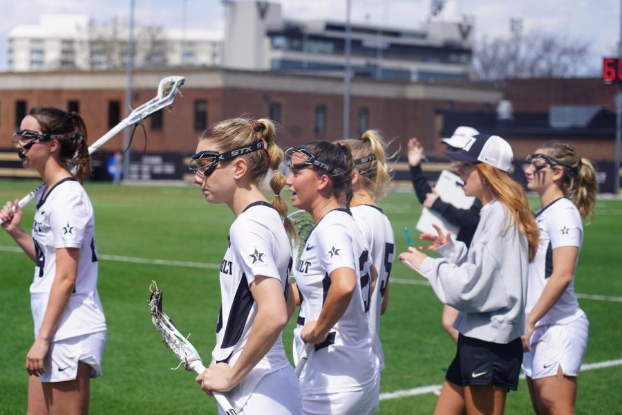 Vanderbilt Lacrosse cheers from the bench, as photographed on March 25, 2023. (Hustler Multimedia/Anseley Philippe)