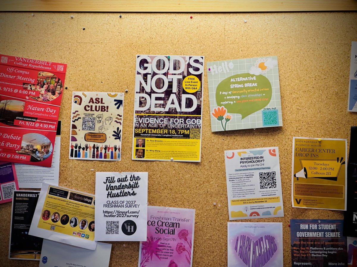 A Gods Not Dead flyer nestles amid a wall of flyers, captured on Sept. 19, 2023. (Hustler Multimedia/Royce Yang)