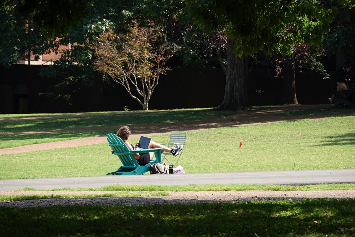 Student studies in the sun on Library Lawn, as photographed on Sept. 7, 2023. (Hustler Multimedia/Abby Hoelscher)